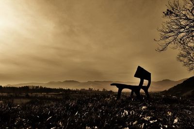Scenic view of landscape against cloudy sky