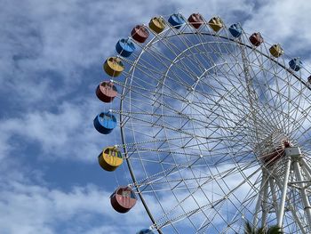 Low angle view of ferris wheel against sky