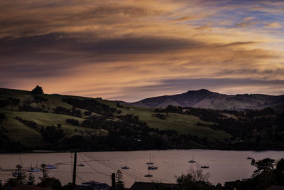 Scenic view of silhouette mountains against sky at sunset