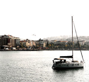 Nautical vessel on river against clear sky