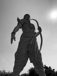 Low angle view of statue against sky