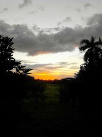 Scenic view of landscape against cloudy sky