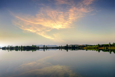 Scenic view of lake against sky during sunset