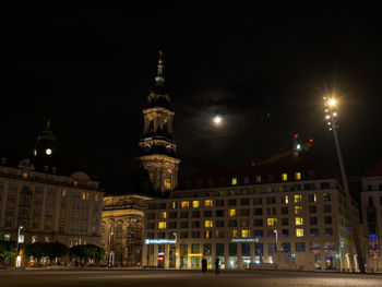 Illuminated buildings in city at night