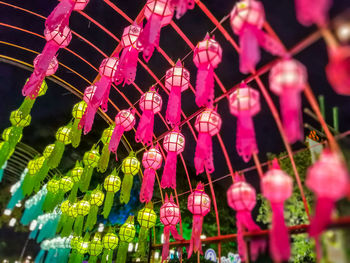 Low angle view of red decorations hanging