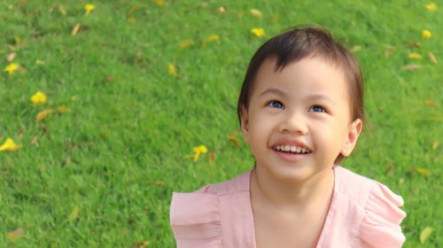 Portrait of smiling boy on grass