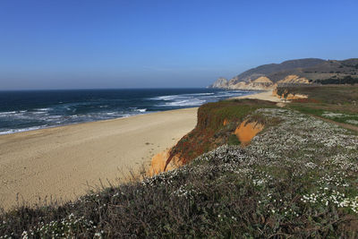 View of beach against clear sky