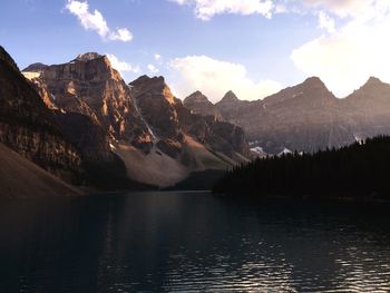 Scenic view of lake and mountains against sky