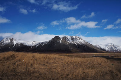 Scenic view of snowcapped mountains against sky