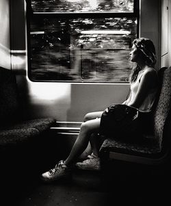 Woman sitting in bus