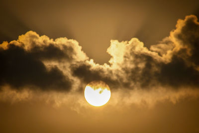 Low angle view of sun in sky