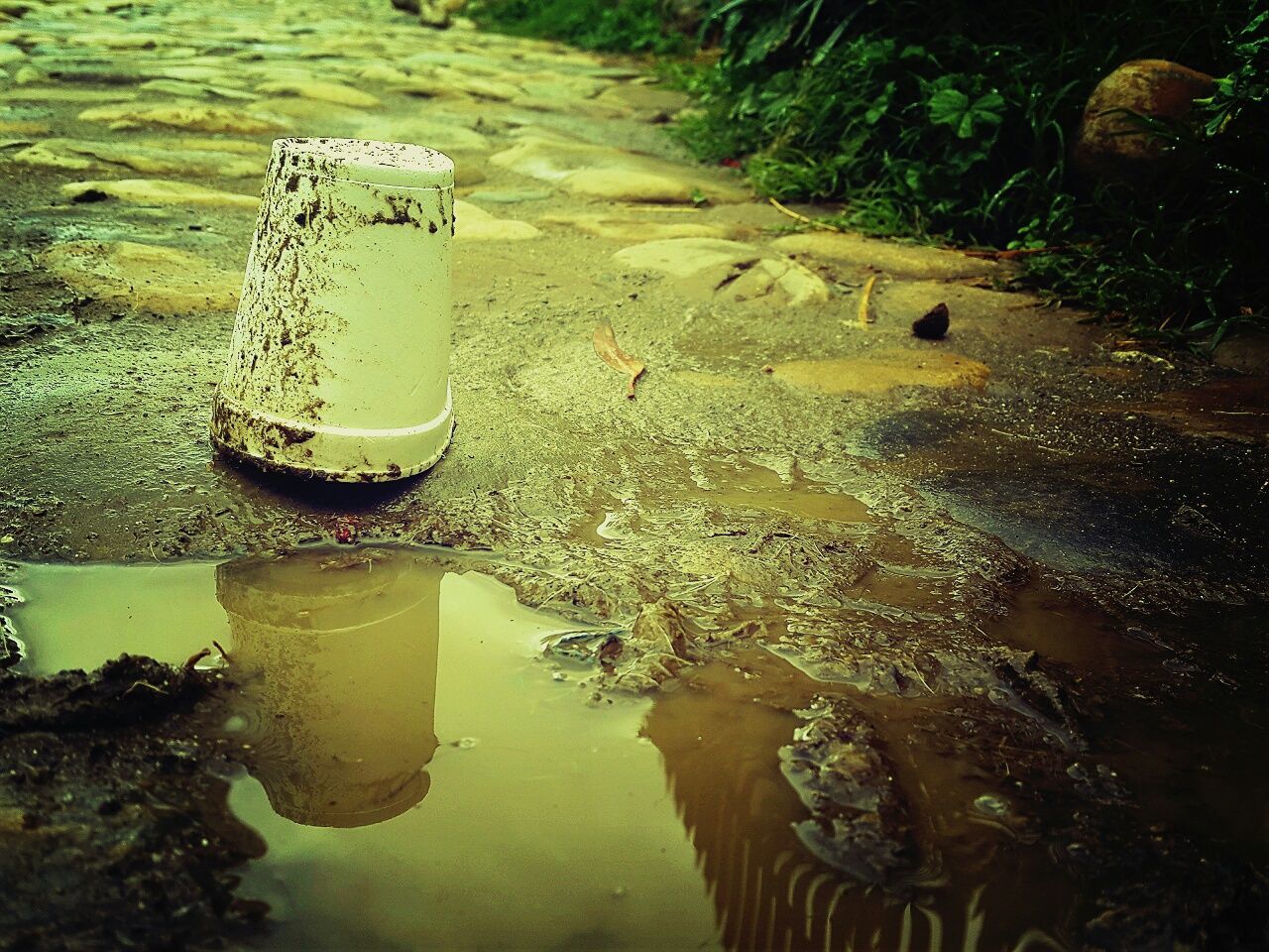 drink, water, refreshment, high angle view, food and drink, reflection, table, still life, no people, close-up, day, outdoors, freshness, drinking glass, sunlight, bottle, beach, nature, sand