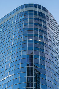 Low angle view of modern buildings against clear sky