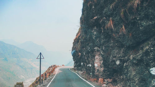 Panoramic view of road amidst mountains against sky