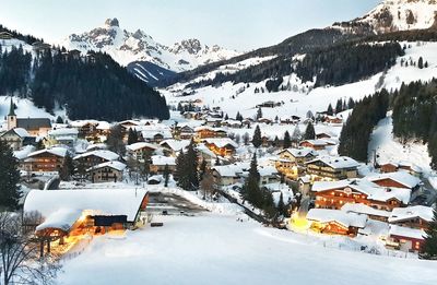 Snow covered houses and buildings in city