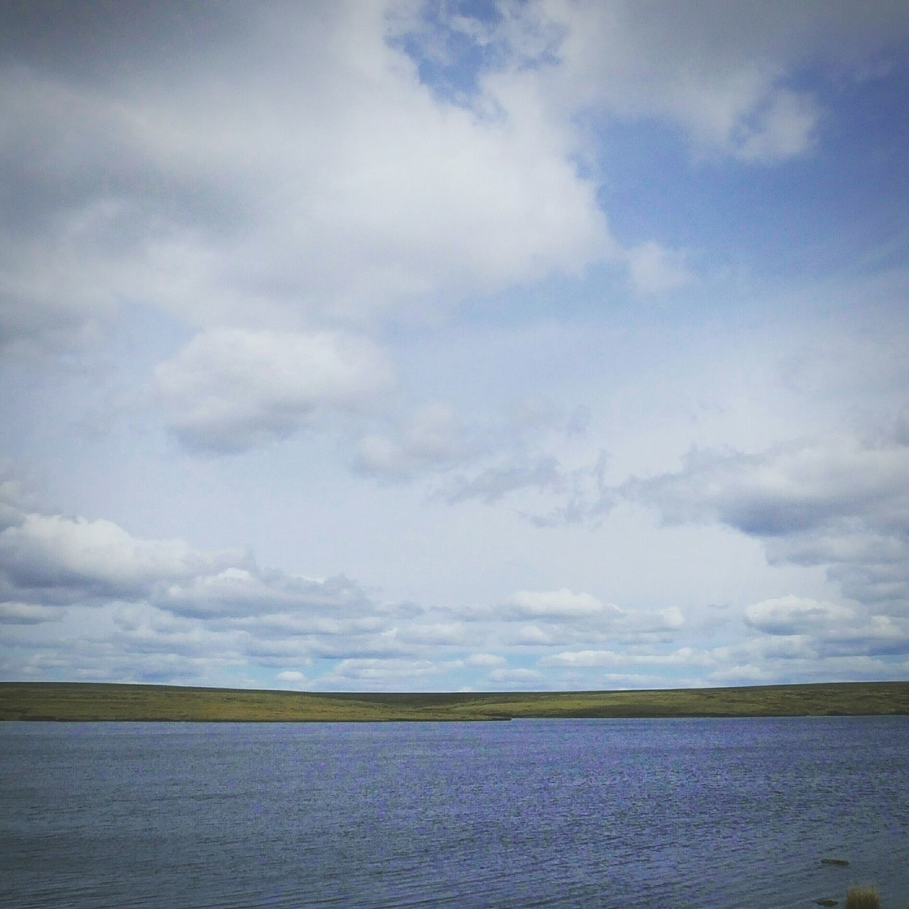 water, waterfront, sky, sea, tranquil scene, tranquility, scenics, beauty in nature, cloud - sky, nature, cloudy, cloud, rippled, horizon over water, idyllic, blue, outdoors, day, no people, remote