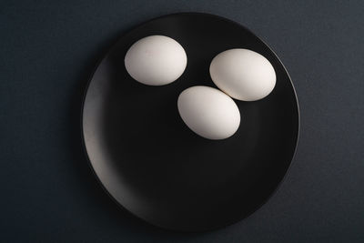 High angle view of eggs in bowl on table