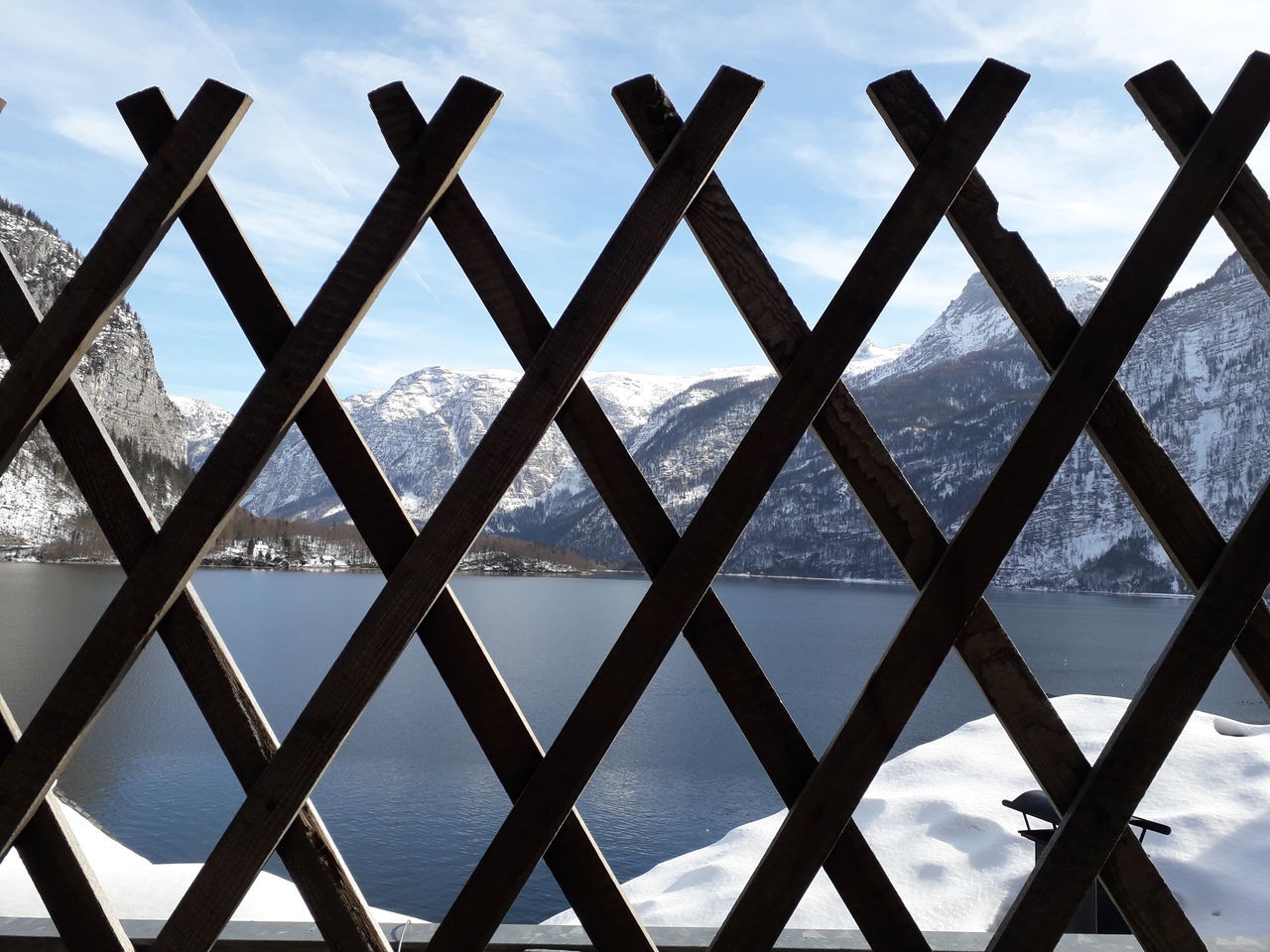 SCENIC VIEW OF SEA AGAINST SKY SEEN THROUGH METAL