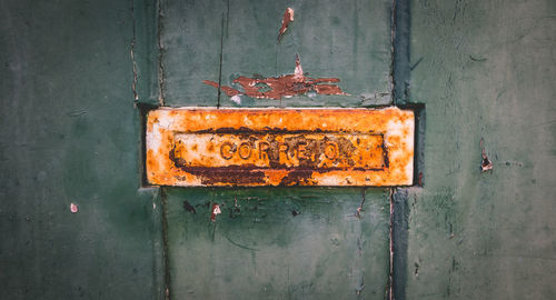 Close-up of old rusty metal door