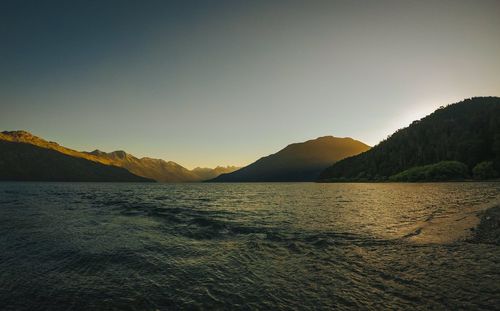 Scenic view of sea against clear sky during sunset
