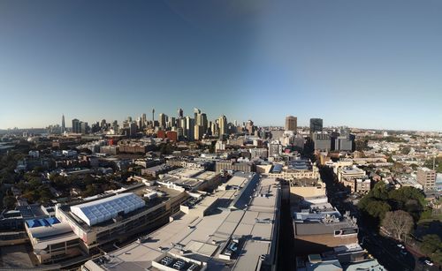 High angle view of buildings in city against clear sky