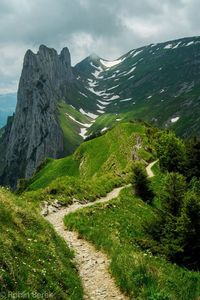 Scenic view of mountain road against sky