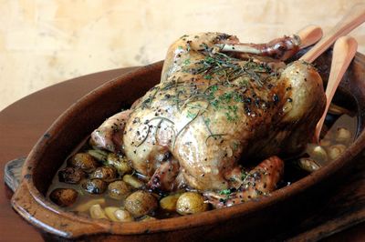 Close-up of roasted chicken in bowl on table