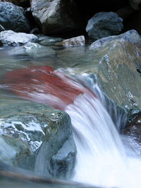 Close-up of water flowing through rocks