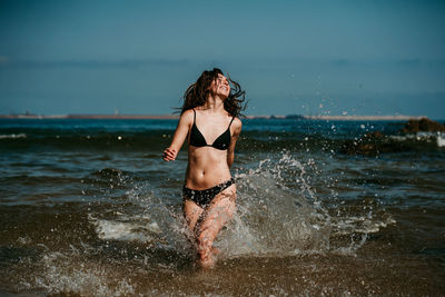 Young woman in bikini on beach