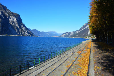 Scenic view of mountains against clear blue sky