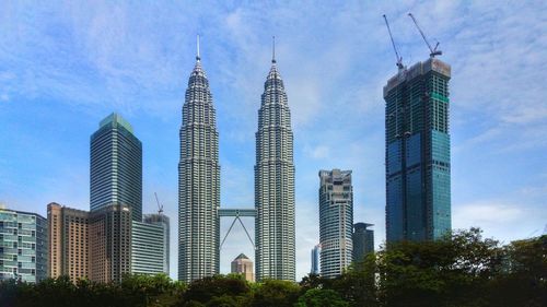 Low angle view of skyscrapers against sky