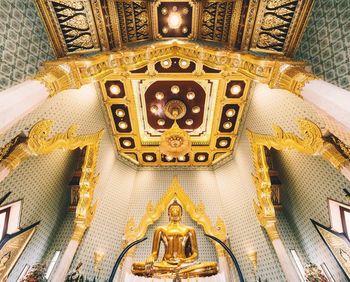 Low angle view of buddha statue in temple