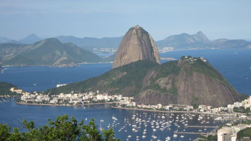 High angle view of cityscape by sugarloaf mountain against sky