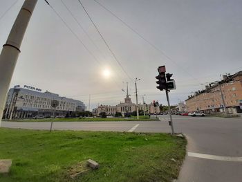 View of street against cloudy sky