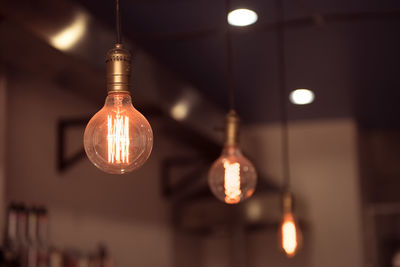 Illuminated light bulbs hanging