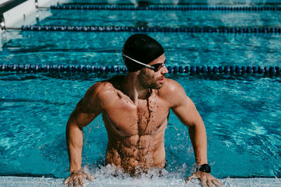 Man swimming in pool