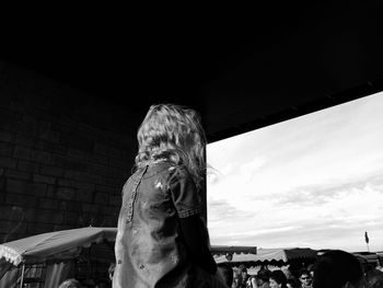 Close-up of woman against sky