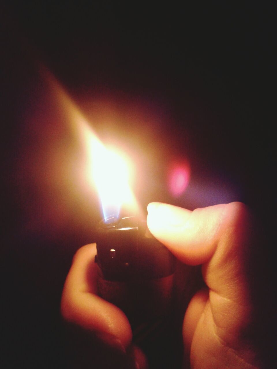 person, part of, holding, human finger, cropped, lifestyles, indoors, unrecognizable person, close-up, illuminated, glowing, burning, leisure activity, flame, copy space, dark