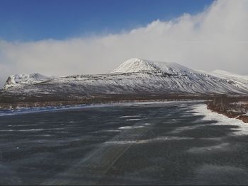 Scenic view of snowcapped mountain against sky