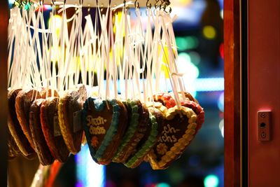 Close-up of heart shape decorations hanging at market stall