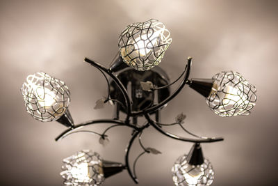 Metal ceiling chandelier with with five shades, in which are installed led light bulbs