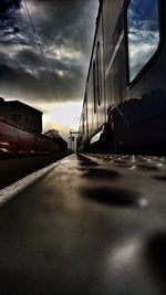 Road by bridge against sky