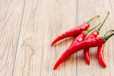 Close-up of red chili peppers on table