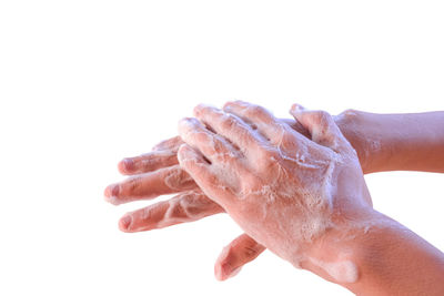 Close-up of hand against white background