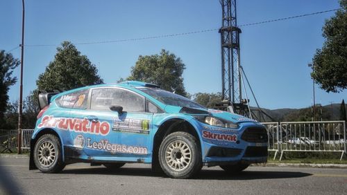 Cars on road against blue sky