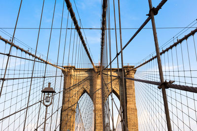 Low angle view of brooklyn bridge against sky