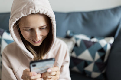 Young woman using phone