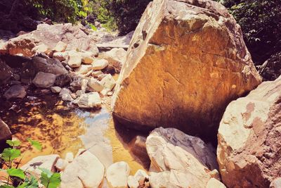 High angle view of rocks by river