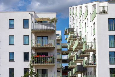 White residential building with many balconies seen in malmoe, sweden