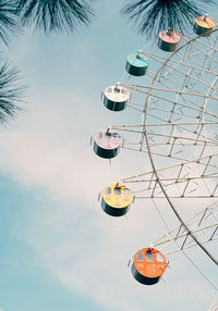 Low angle view of ferris wheel against sky